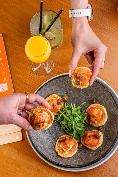 Salmon blinis mimosas